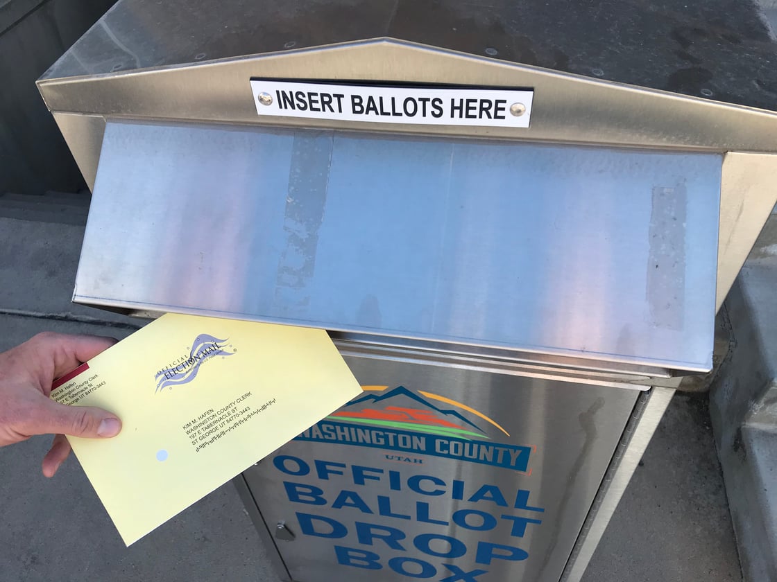 Voter drops off their ballot at the official ballot drop box at the Washington County Administration Building (Reuters - USA Today News)