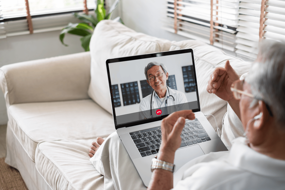 Doctor speaks with patient during a web call session.