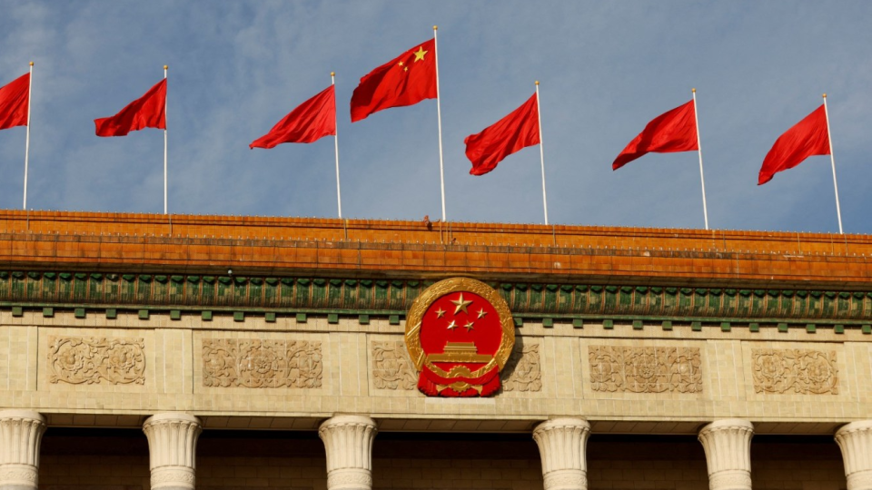 A Chinese flag flutters on top of the Great Hall of the People ahead of the opening ceremony of the Belt and Road Forum, to mark 10th anniversary of the Belt and Road Initiative, in Beijing, China