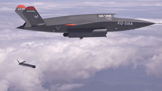 A Kratos XQ-58 Valkyrie unmanned aircraft demonstrates launching a drone from an internal bay