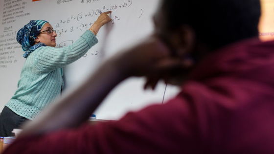 A Newark Prep Charter School student listens to math teacher Faiza Sheikh give a lesson