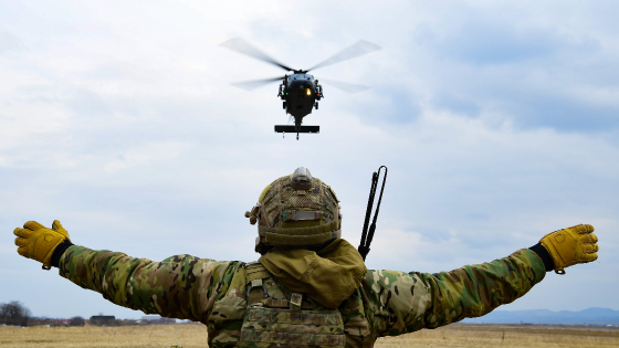 A US Air Force pararescueman assigned to the 57th Rescue Squadron performs dynamic hoist training