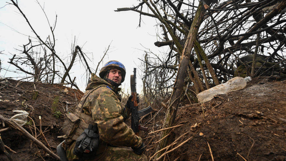 A Ukrainian serviceman of the 65th Mechanised Brigade of the Ukrainian Armed Forces looks on from a trench at a position near the front line village of Robotyne, amid Russias attack on Ukraine, in Zaporizhzhia re