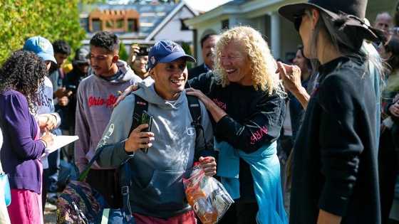 A Venezuelan migrant reacts as he is led onto a bus at St. Andrews Episcopal Church