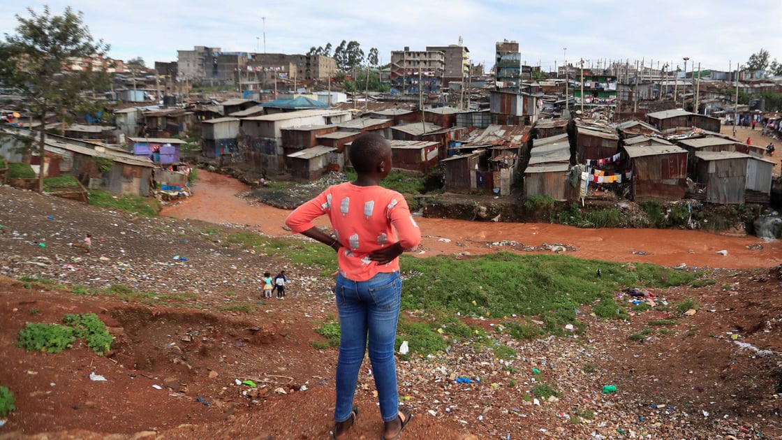 A child looks at the Mathare Valley slums amid the spread of the coronavirus disease