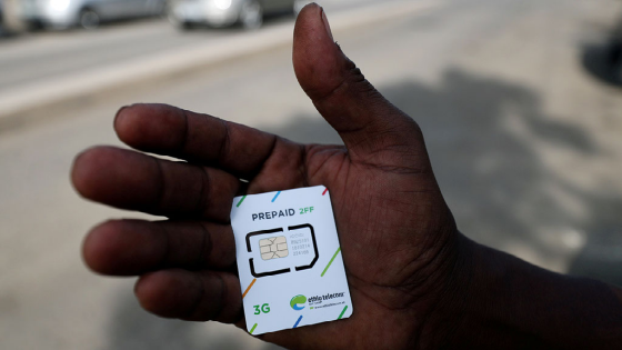 A customer holds a 3G prepaid sim card after buying the service from an Ethio-Telecom shop in Addis Ababa