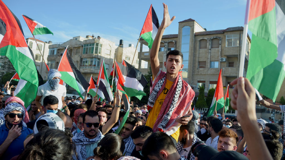 A demonstrator gestures during a protest to express solidarity with the Palestinian people