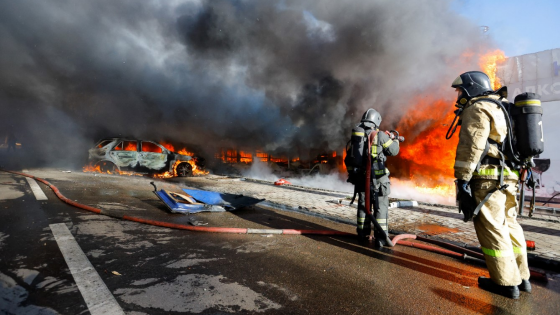 A firefighter works to extinguish fire at market stalls hit by shelling in the course of Russia-Ukraine conflict in Donetsk