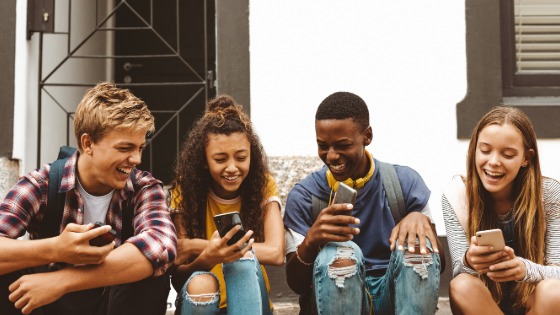 A group of young Americans on their cell phones