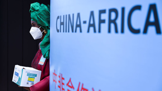 A hostess stands before the opening of the Forum on China-Africa Cooperation