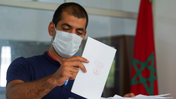 A man casts his vote at a polling station during parliamentary and local elections in Casablanca