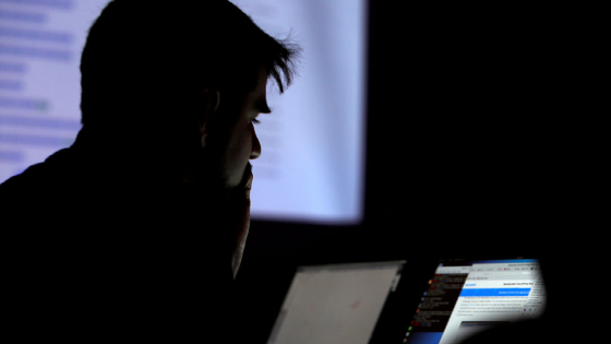 A man takes part in a hacking contest during the DEF CON hacker convention in Las Vegas