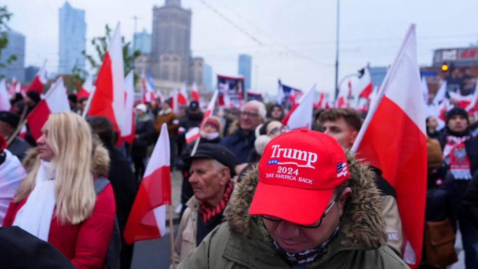 A man wears a hat in support of Donald Trump during the Independence March to mark the 106th anniversary of Polish independence in Warsaw