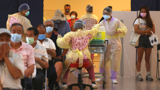 A medical worker administers a dose of the AstraZeneca vaccine against the coronavirus disease