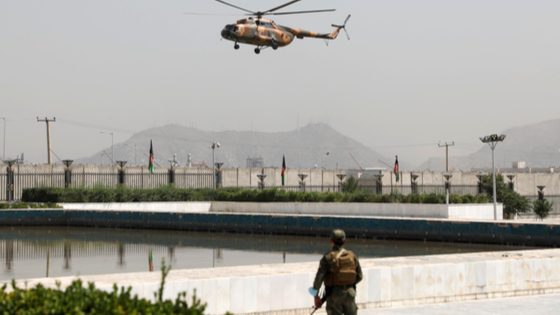 A military helicopter carrying Afghan President Ashraf Ghani prepares to land near the parliament in Kabul