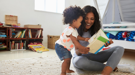 A mother reads to her toddler