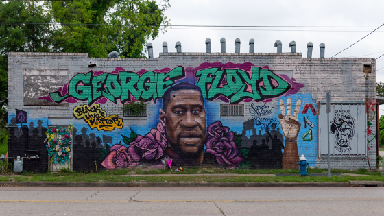 A mural of George Floyd is seen on a wall in his hometown of Third Ward, TX