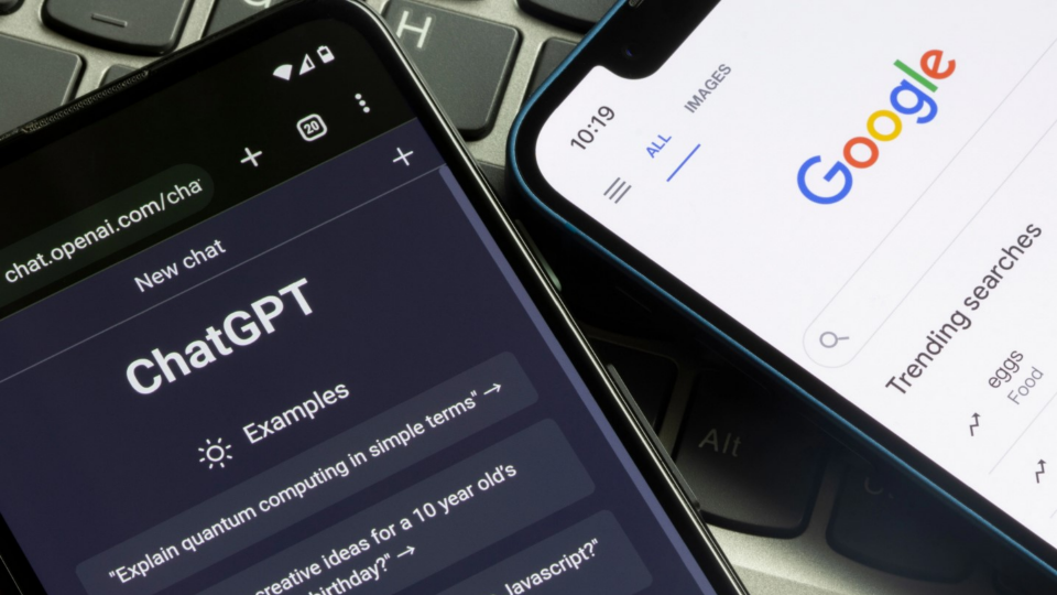 A phone with ChatGPT prompts and another phone with Google trending searches displayed on their screens