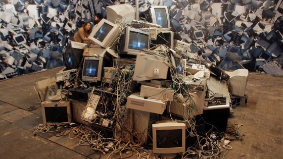 A pile of destroyed desktops and screens are seen as part of a a performance during the International Telecoms Fair in Madrid