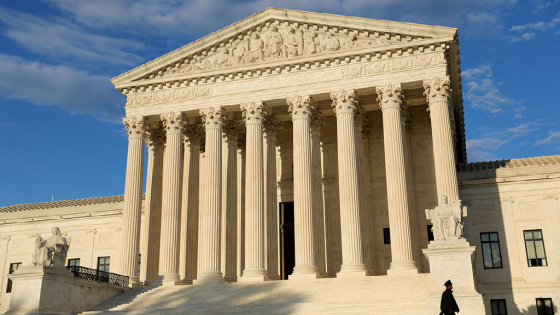 A police officer walks in front of the United States Supreme Court Building in Washington