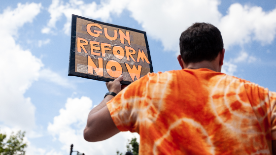 A protester carries a sign calling for greater gun regulation during a rally and march against gun violence at the U.S. Capitol