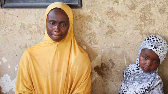 A relative of one of the missing school girls reacts in Dapchi in the northeastern state of Yobe