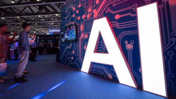 A signage of Artificial Intelligence is seen at the stand of Xiaomi during the 2018 China Mobile Global Partner Conference