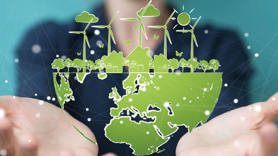 A student holds a replica of Earth with wind mills