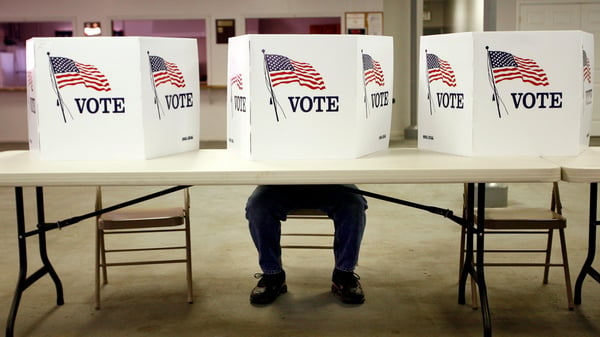 A voter casts a ballot at the Flushing Volunteer Fire Department in Flushing, Ohio