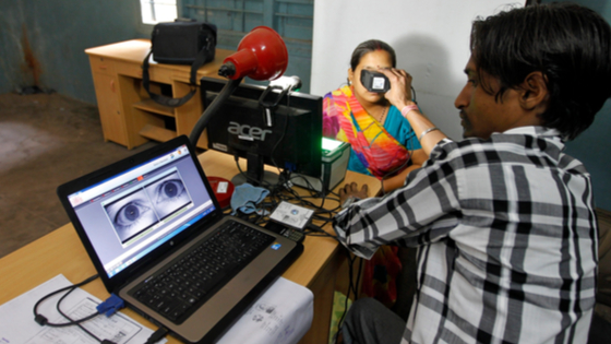 A woman goes through the process of eye scanning for the Aadhaar biometric identity program