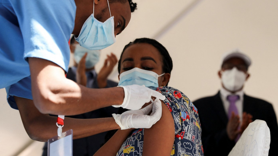 A woman receives a COVID19 vaccine at the Eka Kotebe General Hospital in Addis Ababa