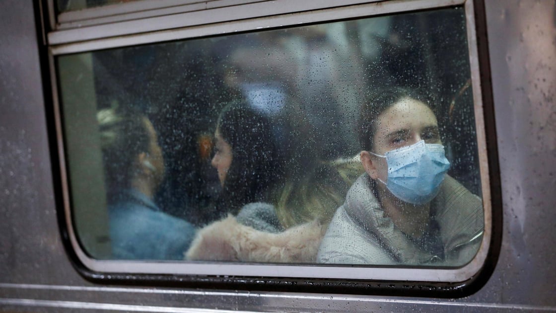 A woman wears a face mask on the subway as the coronavirus outbreak continued in Manhattan