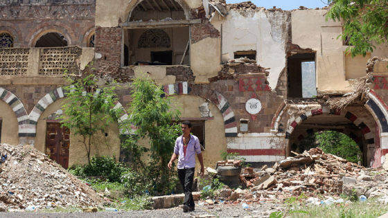 A worker walks past the National Museum in the southwestern city of Taiz