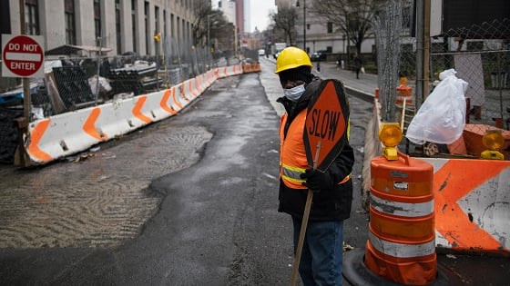 A worker wears a face mask during the outbreak of coronavirus disease (COVID-19), in New York City.