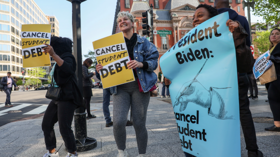 Activists demonstrate outside an entrance to the White House calling for the cancellation of student debt in Washington