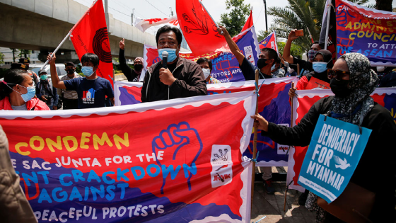 Activists hold placards and banners during a protest to support the anti-coup movement and democracy in Myanmar