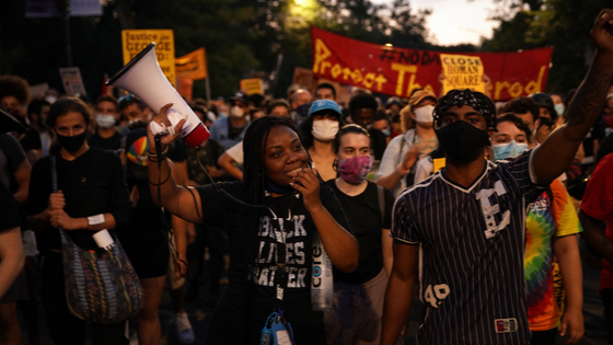 Activists march through Chicago during a Defund the Police rally