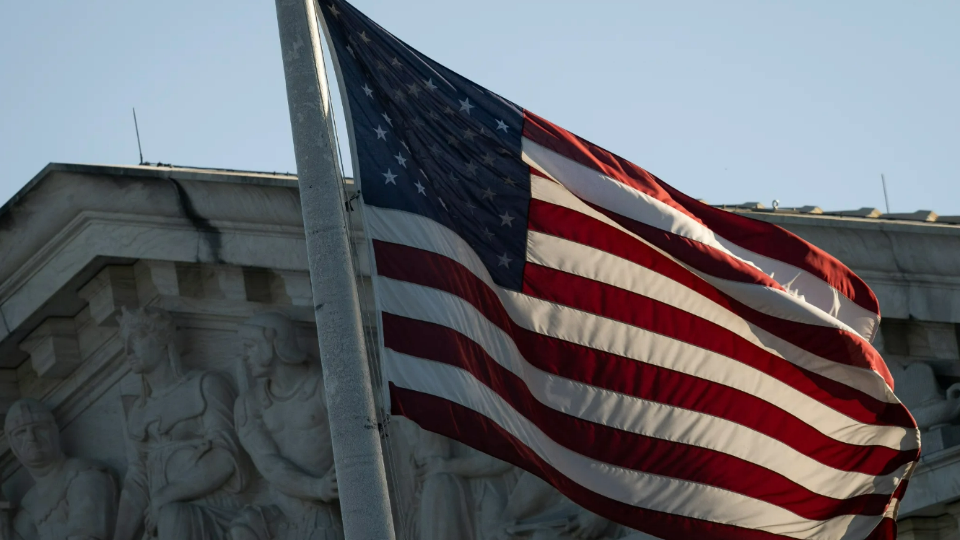 An American flag flies in front of the U.S. Supreme Court Building, in Washington, D.C., on Tuesday, September 19, 2023