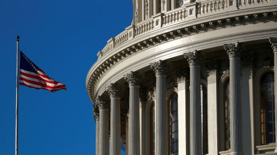 An American flag flies outside of the U.S. Capitol dome