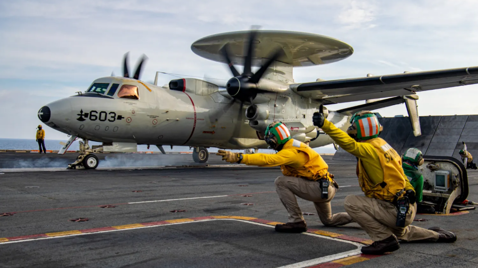 An E-2C Hawkeye from the Sun Kings of Carrier Airborne Early Warning Squadron 116 launches from the flight deck of the aircraft carrier USS Nimitz in the Indo-Pacific region