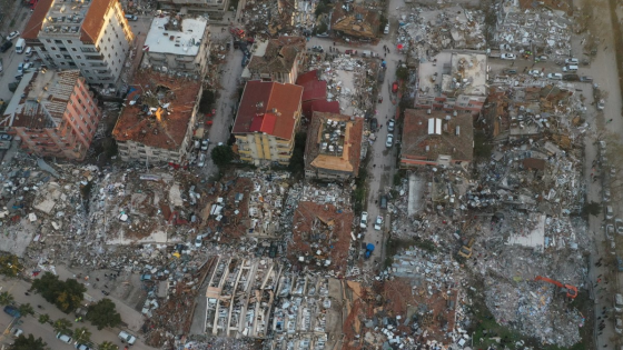 An aerial view shows collapsed and damaged buildings following an earthquake in Hatay