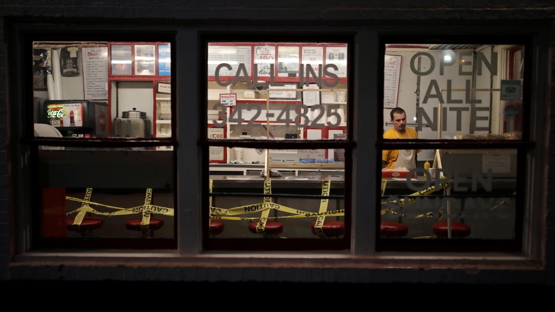 An employee prepares a take away order at a fast food restaurant as the spread of the coronavirus disease affects local business in Roanoke, Virginia