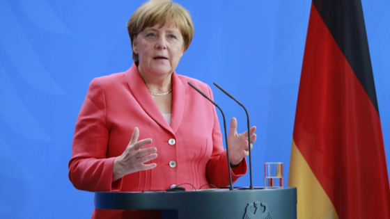 Angela Merkel speaks at podium