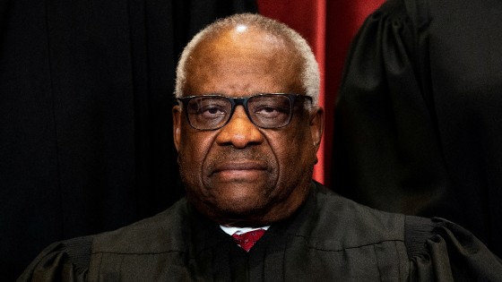 Associate Justice Clarence Thomas poses during a group photo of the Justices at the Supreme Court