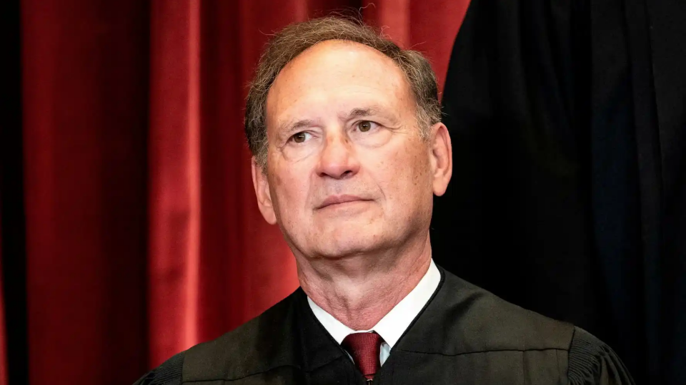 Associate Justice Samuel Alito poses during a group photo of the Justices at the Supreme Court in Washington
