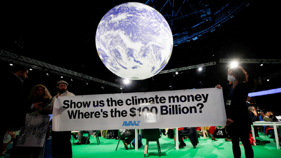 Avaaz activists hold a sign during the UN Climate Change Conference