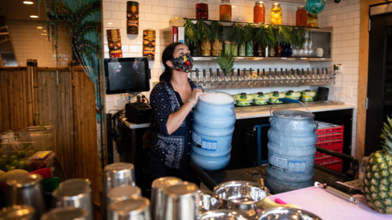 Bartender restocks the outdoor bar at Farmers Fishers Bakers in Washington, DC