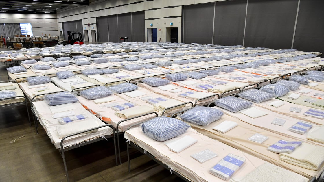 Beds are seen in a field hospital which will provide extra intensive care space for patients with coronavirus disease