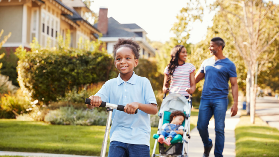 Black family walking in their neighborhood