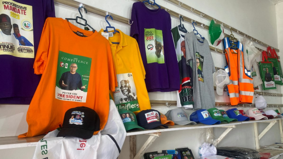 Branded T-shirts, baseball caps and notebooks with images of Nigerian presidential candidates are displayed at a shopping center in Abuja